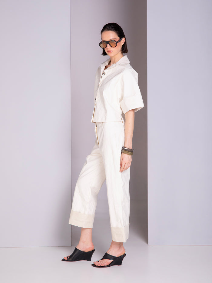 Shirt-style blouse with robe-inspired panel cuts in linen
