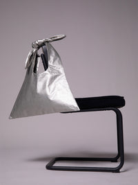 Bag with knot in metallic linen